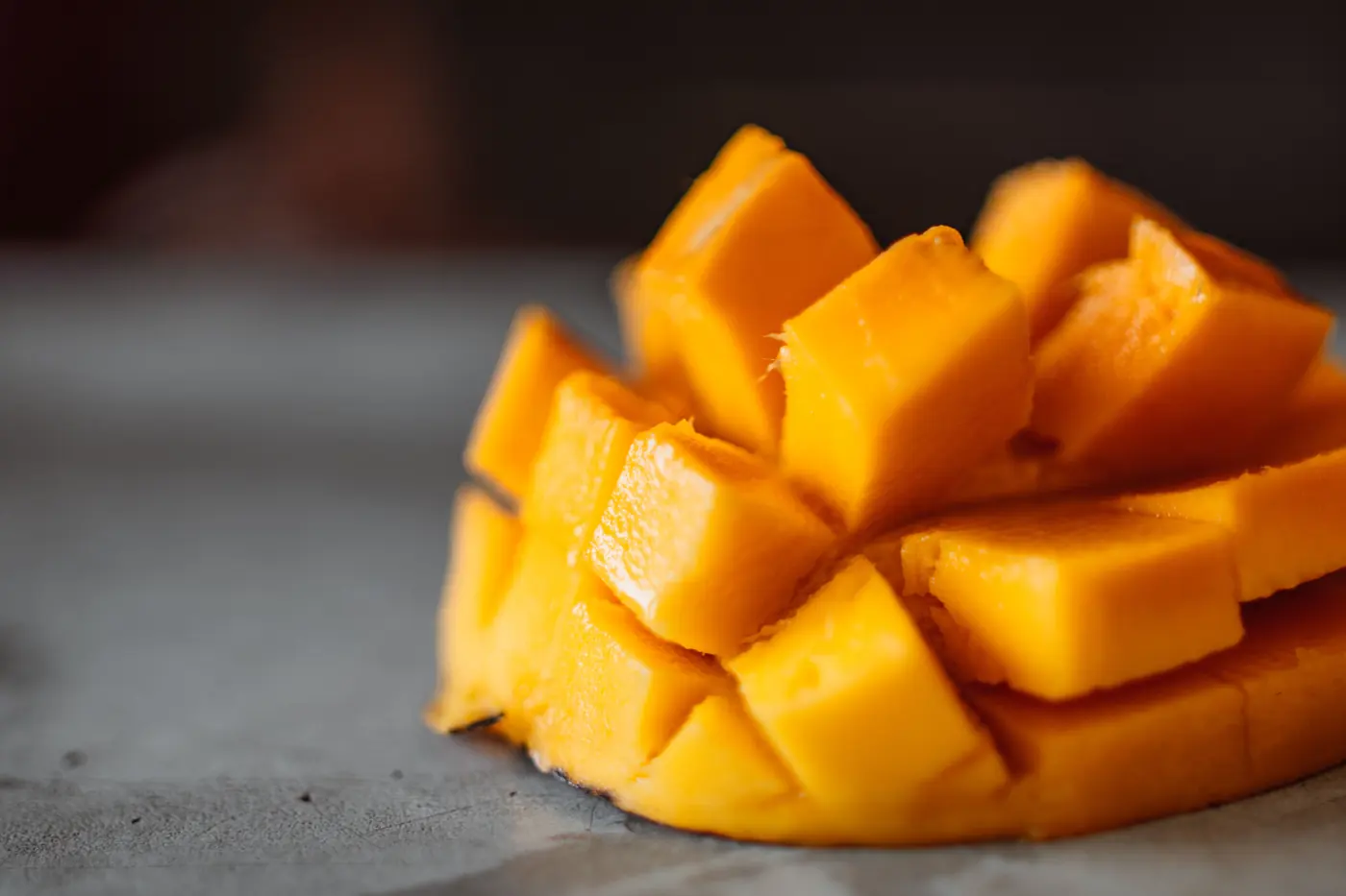 Close-up of golden mango flesh cut into cubes